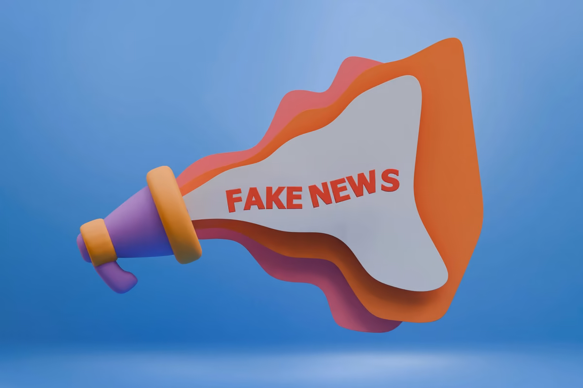 Three-dimensional illustration of a colorful megaphone emitting sound waves with the words 'FAKE NEWS' printed in the center.